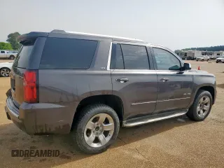 2015 Chevrolet Tahoe LTZ z VIN 1GNSCCKC8FR102859, wystawiony jako Copart lot #56755555 z przebiegiem 167 191 mil mil oraz Czysty tytuł • Clean title. Historia ofert i sprzedaży dostępna na DreamBid. Obrazek 3.