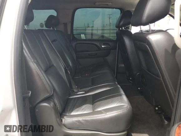 2010 Chevrolet Suburban LT with VIN 1GNUCJE02AR229968, listed as a Copart auction lot 56762975 with 305,863 mi miles and Salvage title. Bid and sale history available at DreamBid. Image 11.
