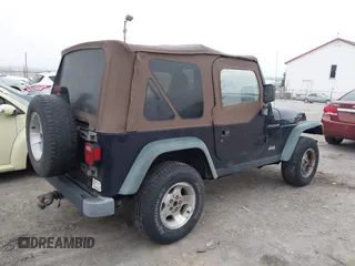 1998 Jeep Wrangler SE with VIN 1J4FY29P9WP792089, listed as a IAAI auction lot 41794793 with 200,838 mi miles. Bid and sale history available at carsss.com. Image 4.