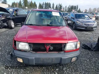 1999 Subaru Forester L with VIN JF1SF6357XH748358, listed as a IAAI auction lot 41885337 with 201,441 mi miles. Bid and sale history available at carsss.com. Image 13.