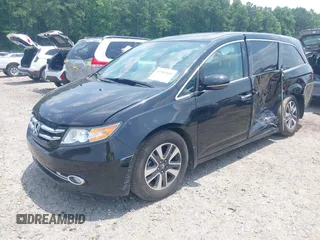 2015 Honda Odyssey Touring Elite with VIN 5FNRL5H90FB003506, listed as a IAAI auction lot 42585049 with 120,543 mi miles and . Bid and sale history available at DreamBid. Image 2.