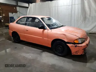 1997 Hyundai Accent z VIN KMHVD14NXVU221266, wystawiony jako Copart lot #86383044 z przebiegiem 159 517 mil mil oraz Szkody całkowita. Historia ofert i sprzedaży dostępna na DreamBid. Obrazek 4.