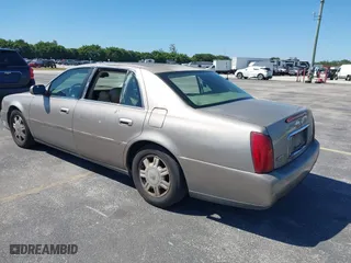 2004 Cadillac DeVille with VIN 1G6KD54Y44U121318, listed as a IAAI auction lot 41833122 with 152,258 mi miles. Bid and sale history available at carsss.com. Image 3.