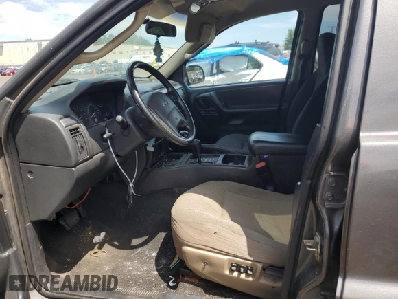 2004 Jeep Grand Cherokee Laredo with VIN 1J4GW48S64C291404, listed as a Copart auction lot 62835335 with 170,365 mi miles and Salvage title. Bid and sale history available at DreamBid. Image 7.