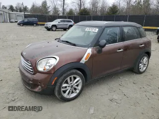 2014 MINI Countryman with VIN WMWZB3C52EWR36567, listed as a Copart auction lot 49076505 with 57,859 mi miles and Salvage Title. Bid and sale history available at DreamBid. Image 1.