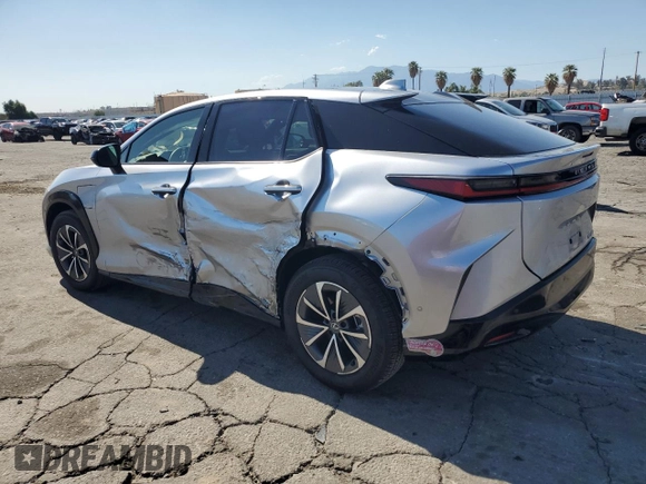 2024 Lexus RZ 300e Premium z VIN JTJABABB6RA002164, wystawiony jako Copart lot #56575245 z przebiegiem 11 687 mil mil oraz Szkoda całkowita • Salvage title. Historia ofert i sprzedaży dostępna na DreamBid. Obrazek 2.