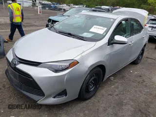2018 Toyota Corolla L with VIN 2T1BURHE5JC007745, listed as a IAAI auction lot 42145183 with 152,661 mi miles and . Bid and sale history available at DreamBid. Image 2.