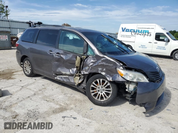 2015 Toyota Sienna XLE with VIN 5TDYK3DC5FS643985, listed as a Copart auction lot 56956505 with 179,131 mi miles and Salvage title. Bid and sale history available at DreamBid. Image 4.
