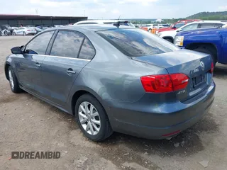 2014 Volkswagen Jetta Sedan SE with VIN 3VWD07AJ7EM238799, listed as a IAAI auction lot 40234990 with 113,297 mi miles. Bid and sale history available at carsss.com. Image 3.