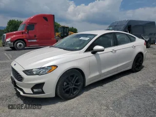 2020 Ford Fusion SE z VIN 3FA6P0HD1LR119649, wystawiony jako Copart lot #63858665 z przebiegiem 133 344 mil mil oraz Czysty tytuł • Clean title. Historia ofert i sprzedaży dostępna na DreamBid. Obrazek 1.