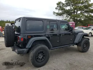 2023 Jeep Wrangler Sport with VIN 1C4HJXDG8PW643414, listed as a Copart auction lot 87768255 with 31,894 mi miles and Salvage Title. Bid and sale history available at DreamBid. Image 3.
