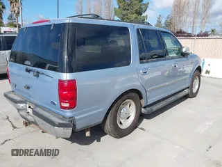 1998 Ford Expedition XLT z VIN 1FMPU18L8WLA56178, wystawiony jako IAAI lot #41920438 z przebiegiem 270 941 mil mil oraz . Historia ofert i sprzedaży dostępna na DreamBid. Obrazek 4.