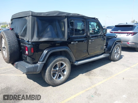 2018 Jeep Wrangler Unlimited Sahara with VIN 1C4HJXEN7JW328981, listed as a IAAI auction lot 42217508 with 59,584 mi miles and . Bid and sale history available at DreamBid. Image 4.