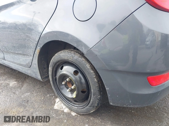 2012 Hyundai Accent SE with VIN KMHCU5AE4CU037411, listed as a IAAI auction lot 41659662 with 163,021 mi miles. Bid and sale history available at carsss.com. Image 6.