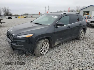 2015 Jeep Cherokee Latitude with VIN 1C4PJLCB9FW706934, listed as a Copart auction lot 52696105 with 125,205 mi miles and Salvage Title. Bid and sale history available at DreamBid. Image 1.