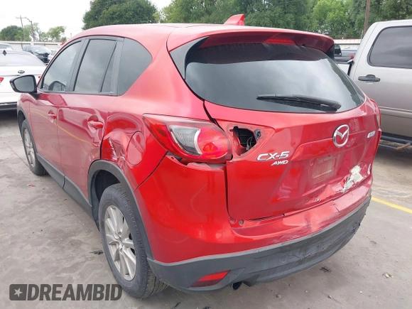 2015 Mazda CX-5 Touring with VIN JM3KE4CYXF0439953, listed as a IAAI auction lot 42124197 with 242,614 mi miles and . Bid and sale history available at DreamBid. Image 3.