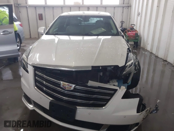 2018 Cadillac XTS Luxury z VIN 2G61M5S38J9156679, wystawiony jako IAAI lot #41574733 z przebiegiem 65 637 mil mil oraz . Historia ofert i sprzedaży dostępna na DreamBid. Obrazek 12.