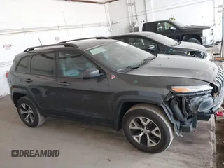 2016 Jeep Cherokee Trailhawk with VIN 1C4PJMBS0GW169184, listed as a IAAI auction lot 42255346 with 152,802 mi miles and . Bid and sale history available at DreamBid. Image 13.
