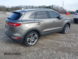 2016 Lincoln MKC Reserve with VIN 5LMCJ3D97GUJ31720, listed as a IAAI auction lot 41655116 with Not provided miles and . Bid and sale history available at DreamBid. Image 4.