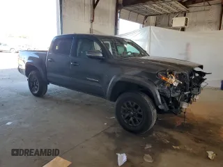 2023 Toyota Tacoma SR z VIN 3TMCZ5AN4PM599664, wystawiony jako Copart lot #57462455 z przebiegiem 65 736 mil mil oraz Szkoda całkowita • Salvage title. Historia ofert i sprzedaży dostępna na DreamBid. Obrazek 4.