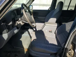 1998 Jeep Cherokee Sport with VIN 1J4FT68S5WL136989, listed as a Copart auction lot 81035084 with 140,848 mi miles and Salvage Title. Bid and sale history available at carsss.com. Image 7.