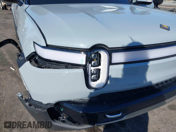 2024 Rivian R1T Adventure z VIN 7FCTGAAA5RN033799, wystawiony jako IAAI lot #41606562 z przebiegiem 9 449 mil mil oraz . Historia ofert i sprzedaży dostępna na DreamBid. Obrazek 6.