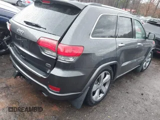2014 Jeep Grand Cherokee Overland with VIN 1C4RJFCT2EC146239, listed as a IAAI auction lot 41368514 with 164,239 mi miles. Bid and sale history available at carsss.com. Image 4.