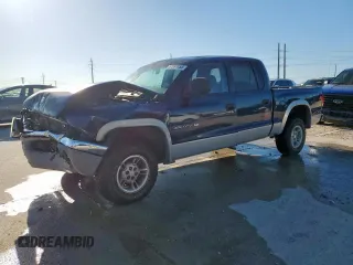 2000 Dodge Dakota Sport z VIN 1B7HG2AZ0YS770402, wystawiony jako Copart lot #57837455 z przebiegiem 247 825 mil mil oraz Szkoda całkowita • Salvage title. Historia ofert i sprzedaży dostępna na DreamBid. Obrazek 1.