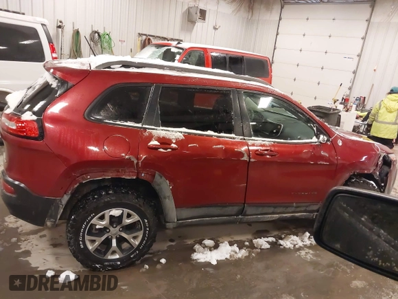 2015 Jeep Cherokee Trailhawk with VIN 1C4PJMBS2FW609999, listed as a IAAI auction lot 41582536 with 133,666 mi miles. Bid and sale history available at carsss.com. Image 13.