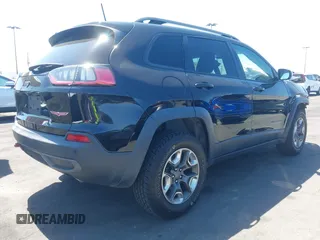 2019 Jeep Cherokee Trailhawk with VIN 1C4PJMBXXKD433284, listed as a IAAI auction lot 42020051 with 57,089 mi miles and . Bid and sale history available at DreamBid. Image 4.