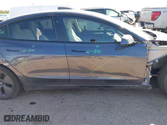 2022 Tesla Model 3 with VIN 5YJ3E1EAXNF326354, listed as a IAAI auction lot 41651872 with 27,922 mi miles and . Bid and sale history available at DreamBid. Image 14.