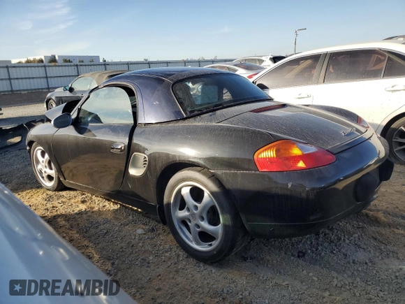 2000 Porsche Boxster z VIN WP0CA2984YU627674, wystawiony jako Copart lot #86027054 z przebiegiem 112 153 mil mil oraz Szkoda całkowita • Salvage title. Historia ofert i sprzedaży dostępna na DreamBid. Obrazek 2.