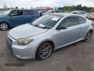 2005 Scion tC with VIN JTKDE177050032815, listed as a IAAI auction lot 42123702 with 228,973 mi miles. Bid and sale history available at carsss.com. Image 2.