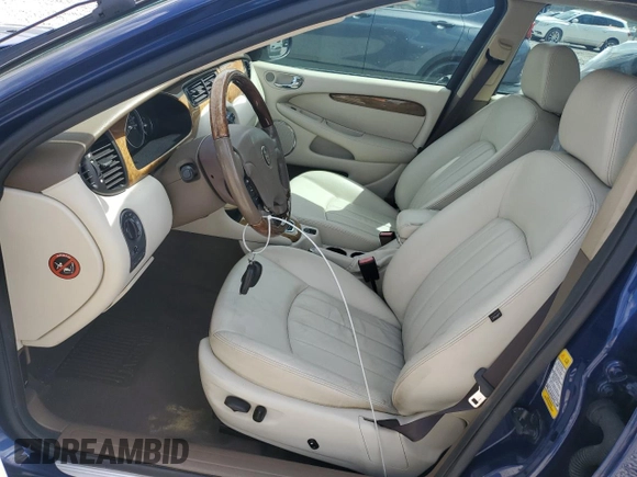 2004 Jaguar X-Type with VIN SAJEA51C44WD83361, listed as a Copart auction lot 55643545 with 54,615 mi miles and Salvage Title. Bid and sale history available at DreamBid. Image 7.