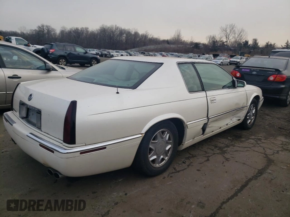 1999 Cadillac Eldorado z VIN 1G6EL12Y5XU600699, wystawiony jako Copart lot #88164505 z przebiegiem 140 075 mil mil oraz Szkoda całkowita • Salvage title. Historia ofert i sprzedaży dostępna na DreamBid. Obrazek 3.