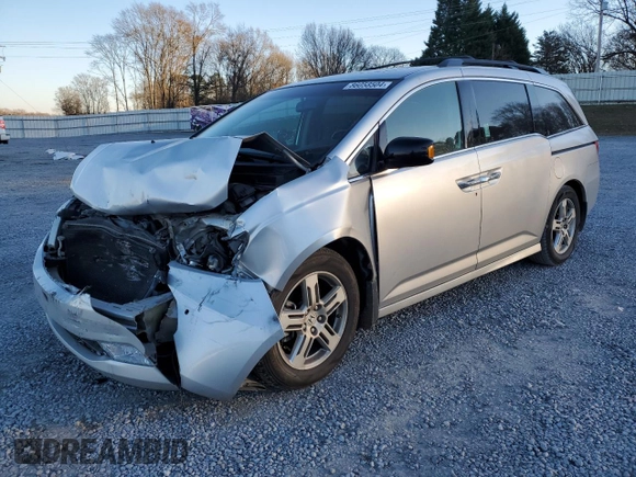 2012 Honda Odyssey Touring with VIN 5FNRL5H9XCB027758, listed as a Copart auction lot 86058504 with 164,860 mi miles and Salvage Title. Bid and sale history available at DreamBid. Image 1.