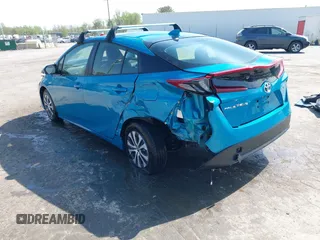 2021 Toyota Prius LE with VIN JTDKAMFP7M3180504, listed as a IAAI auction lot 41985409 with 56,617 mi miles and . Bid and sale history available at DreamBid. Image 3.
