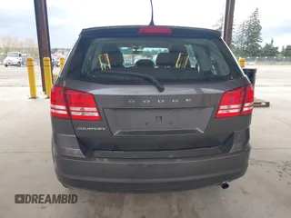 2015 Dodge Journey SE z VIN 3C4PDCAB1FT617794, wystawiony jako IAAI lot #41922371 z przebiegiem 130 558 mil mil oraz . Historia ofert i sprzedaży dostępna na DreamBid. Obrazek 17.
