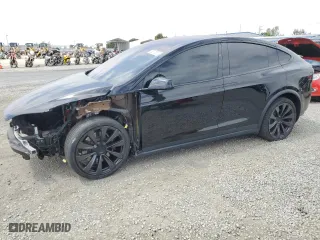2022 Tesla Model X with VIN 7SAXCDE59NF360610, listed as a Copart auction lot 52575365 with 51,557 mi miles and Salvage Title. Bid and sale history available at carsss.com. Image 1.