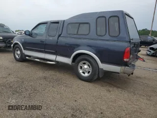 2000 Ford F-150 XL with VIN 1FTRX17L7YNC24292, listed as a Copart auction lot 58852925 with 213,318 mi miles and Salvage title. Bid and sale history available at DreamBid. Image 2.