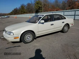 1994 Infiniti Q45 z VIN JNKNG01D3RM252218, wystawiony jako Copart lot #77230944 z przebiegiem 69 069 mil mil oraz Tytuł czysty. Historia ofert i sprzedaży dostępna na DreamBid. Obrazek 1.
