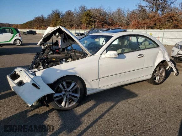 2006 Mercedes-Benz CLK-Class 3.5L with VIN WDBTJ56J76F171100, listed as a Copart auction lot 77068234 with 86,635 mi miles and Salvage Title. Bid and sale history available at carsss.com. Image 1.