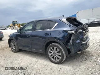 2021 Mazda CX-5 Grand Touring z VIN JM3KFBDM5M0464611, wystawiony jako Copart lot #62829065 z przebiegiem 20 525 mil mil oraz Nie do naprawy • Non repairable. Historia ofert i sprzedaży dostępna na DreamBid. Obrazek 2.
