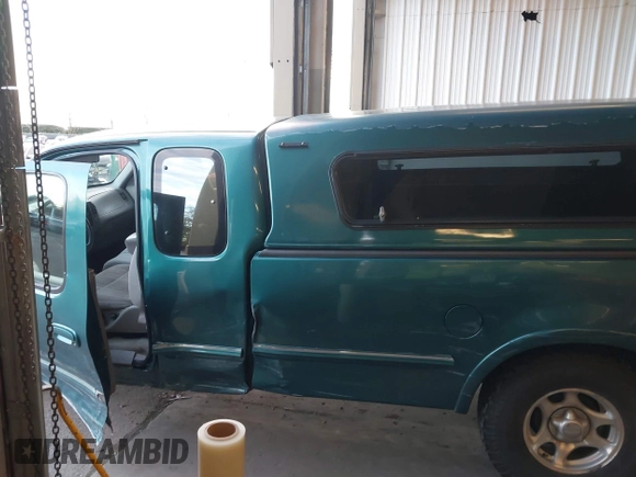 1997 Ford F-150 XL with VIN 1FTEX18L1VKB44867, listed as a IAAI auction lot 41266572 with 105,061 mi miles. Bid and sale history available at carsss.com. Image 14.