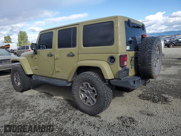 2013 Jeep Wrangler Unlimited Rubicon 10th Anniversary with VIN 1C4HJWFG4DL549065, listed as a Copart auction lot 75899594 with 127,960 mi miles and Salvage title. Bid and sale history available at DreamBid. Image 2.