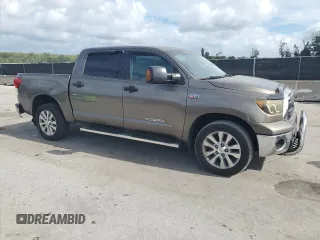 2012 Toyota Tundra z VIN 5TFDW5F14CX216264, wystawiony jako Copart lot #60983285 z przebiegiem 186 869 mil mil oraz Szkoda całkowita • Salvage title. Historia ofert i sprzedaży dostępna na DreamBid. Obrazek 4.