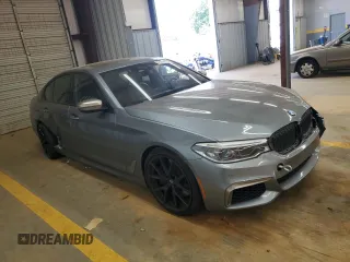 2018 BMW 5 Series M550i xDrive with VIN WBAJB9C55JB050213, listed as a Copart auction lot 61714255 with 34,700 mi miles and Salvage title. Bid and sale history available at DreamBid. Image 4.