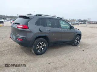 2016 Jeep Cherokee Trailhawk z VIN 1C4PJMBS4GW167650, wystawiony jako IAAI lot #41936549 z przebiegiem 218 000 mil mil oraz . Historia ofert i sprzedaży dostępna na DreamBid. Obrazek 4.
