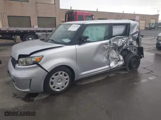 2010 Scion xB with VIN JTLZE4FE9A1110922, listed as a IAAI auction lot 41761378 with 89,000 mi miles. Bid and sale history available at carsss.com. Image 2.