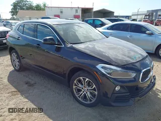 2018 BMW X2 xDrive28i z VIN WBXYJ5C37JEF71272, wystawiony jako IAAI lot #42073863 z przebiegiem 94 947 mil mil oraz . Historia ofert i sprzedaży dostępna na DreamBid. Obrazek 1.